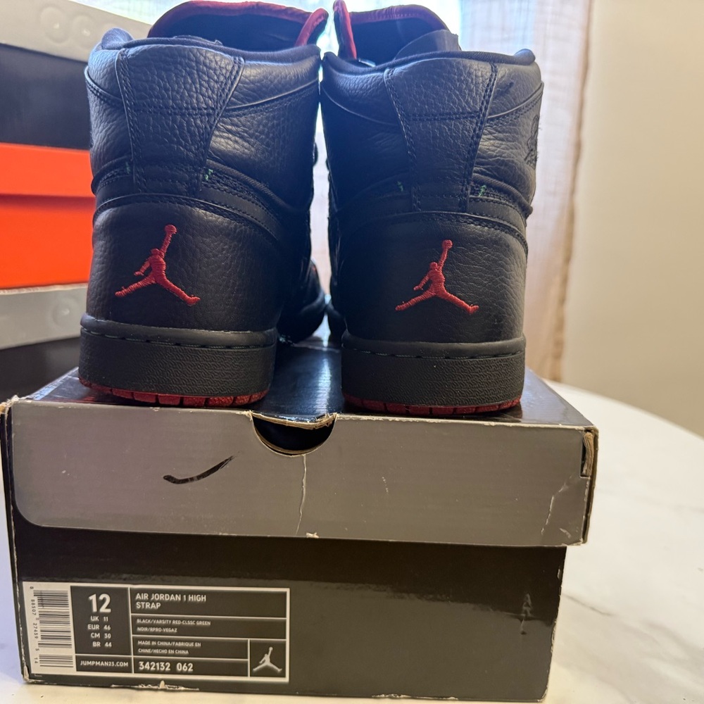 Jordan 1 tribe called quest 
Black with Red Jumpman High-Top Sneakers